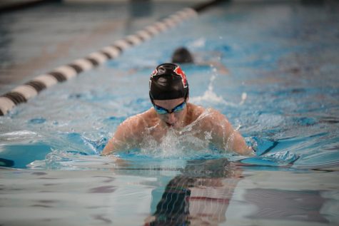 Sophomore Logan ODonnell demonstrates breaststroke during the swim teams first official JV practice.