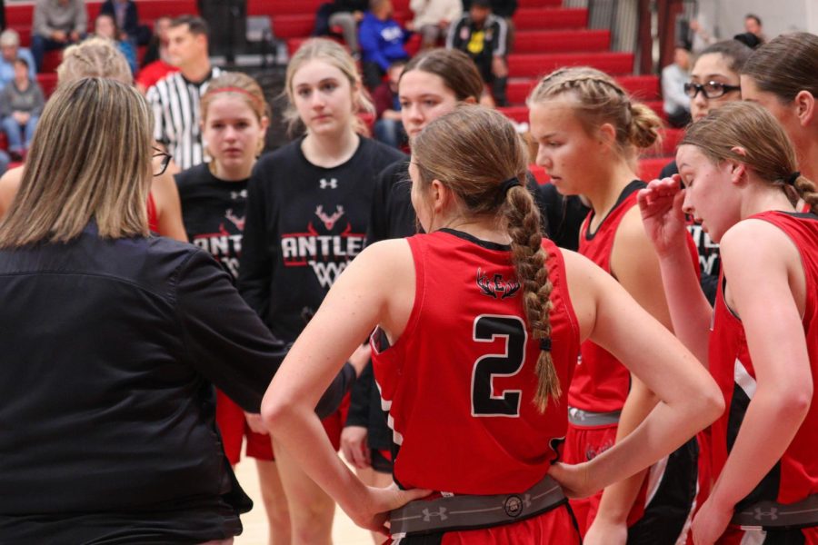 Naomi Bertucci pays attention to Coach Wragge during a timeout during the game.