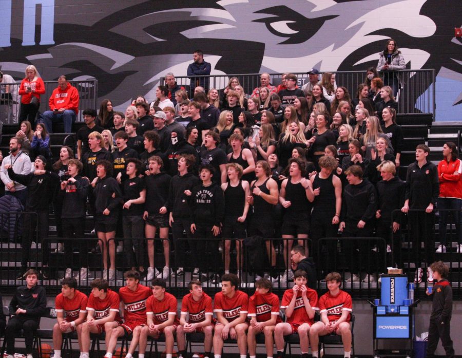 The Elkhorn High student section cheers during the boys basketball game against Elkhorn North. 