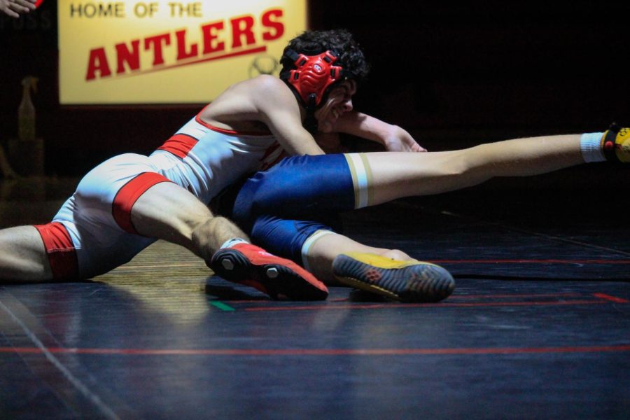 Senior Justin Barreras gets on top of his opponent. Elkhorn Antlers lost to Elkhorn South Storms.