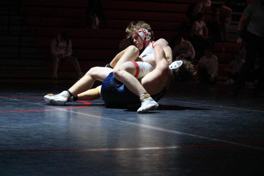 Senior Sean Stara attempts to pin down his opponent. Elkhorn Antlers lost to Elkhorn South Storms.