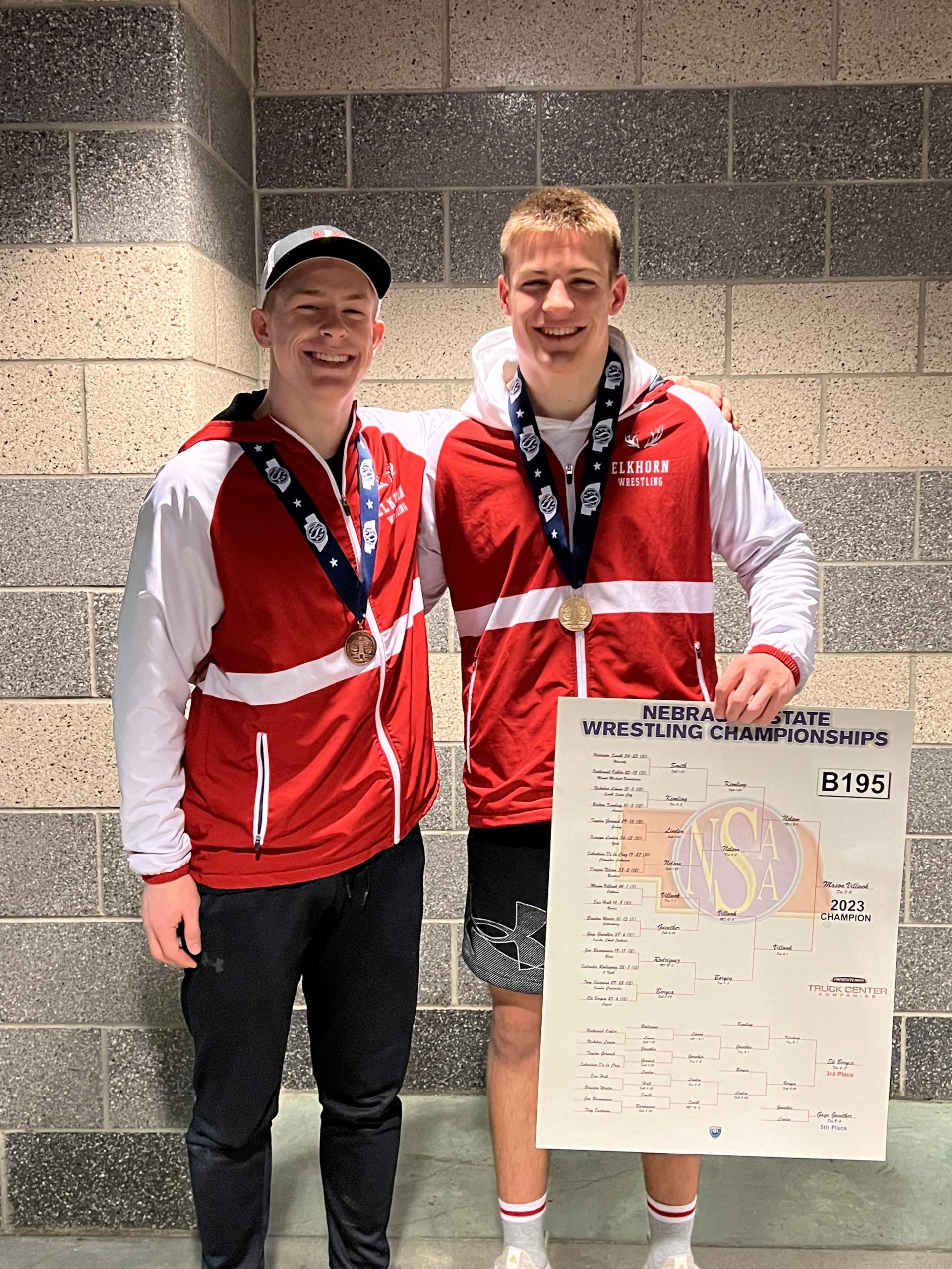 Mason Villwok and Sean Stara come together to congratulate each other on their win at state wrestling. Villwok received first place, and Stara received fifth place.