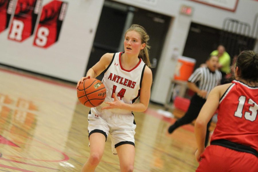 Anna Janvrin looks to find an open player against South Sioux City on 2/23/2023