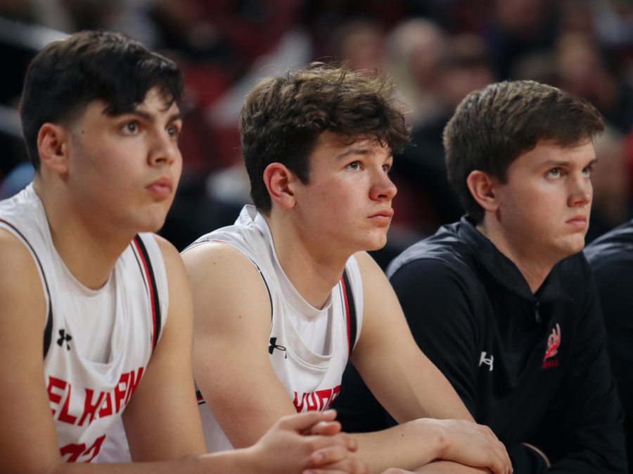As the clock ticks down, (from left to right) Audric Bermel, Charlie Lamski, and Chase Ruch look up at the scoreboard.