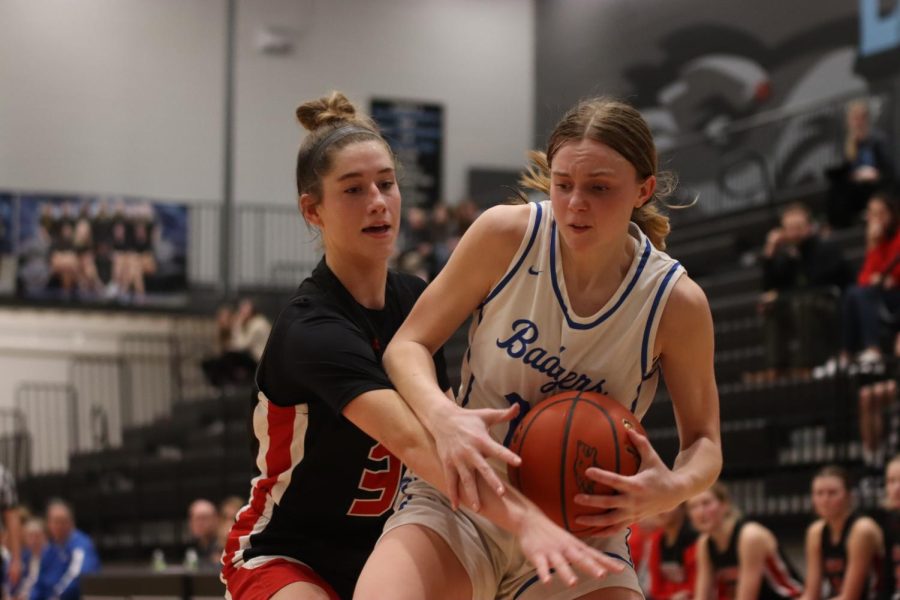 Claire Nuismer defends a Bennington player to keep the Antlers postseason hopes alive.