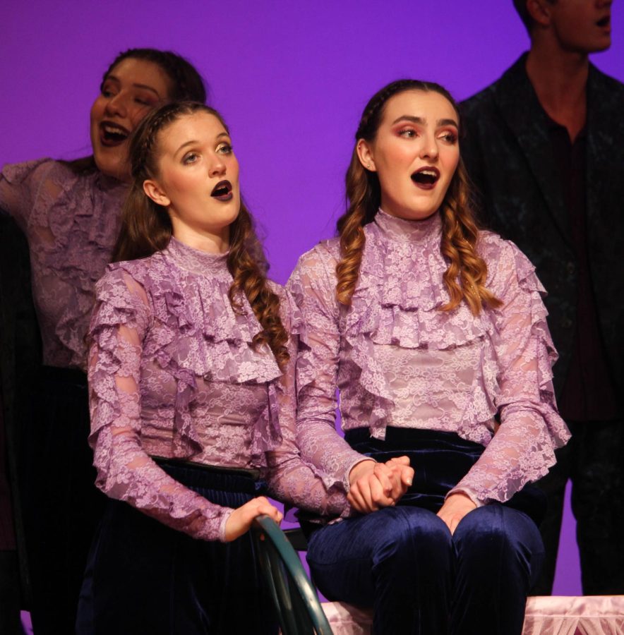 Senior Cassy Limley and junior Jules Joens sing together during their last Excel performance of the year. 