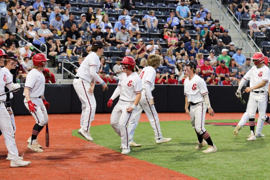 The Elkhorn baseball team celebrates after tying the game with Elkhorn North. They secured their seventh run in the inning, making the score 8-8.