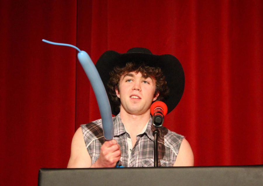 Dyllan Bertucci makes balloon animals during the talent portion of Mr. EHS. 