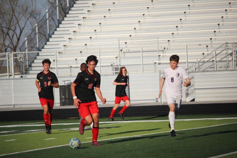 Sophomore Nick Pagliuca dribbles the ball down to the goal. Antlers beat the Falcons 5-0.