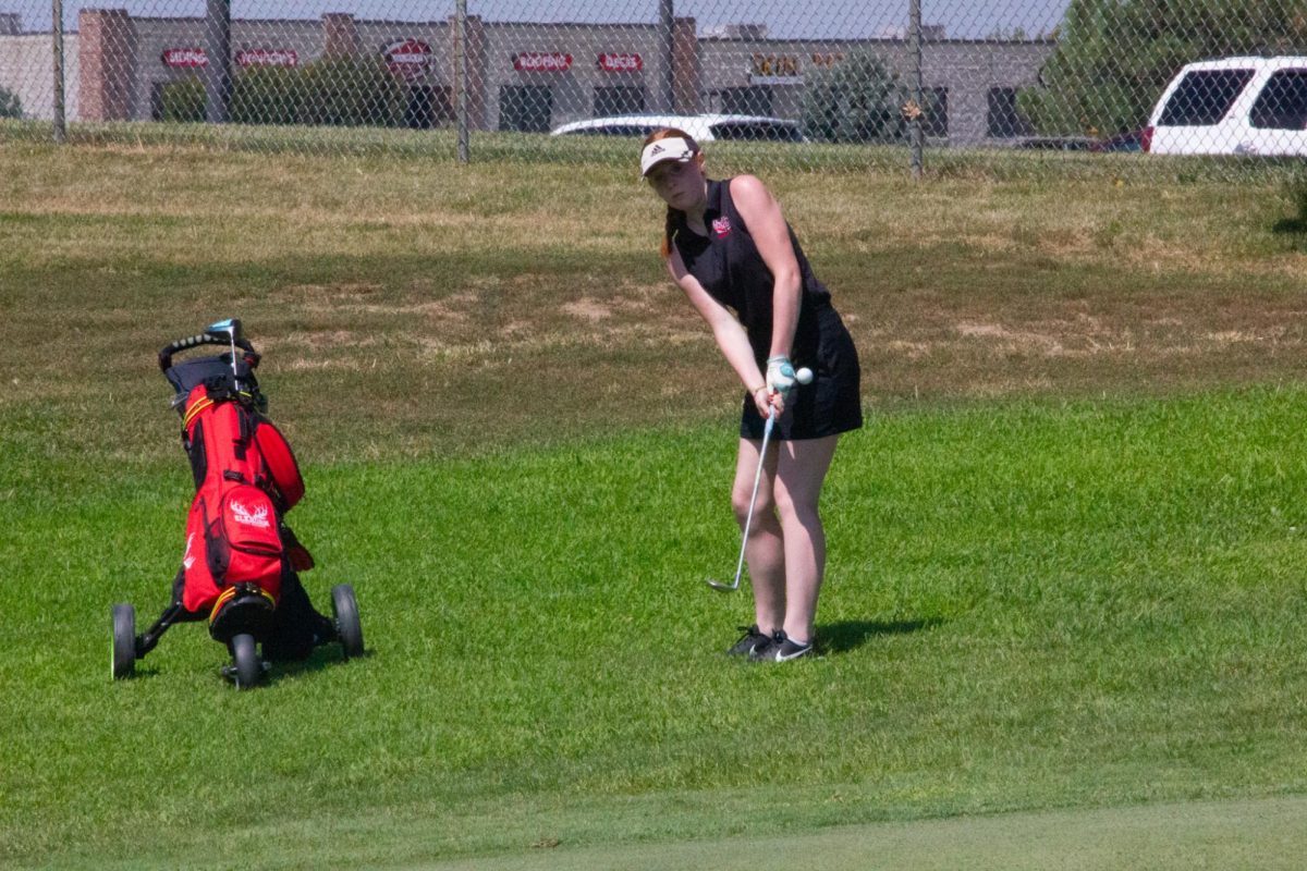 Senior, Alyssa DiNapoli chips the ball onto the green. Antlers beat Waverly in the JV duel on August 29, 2023.