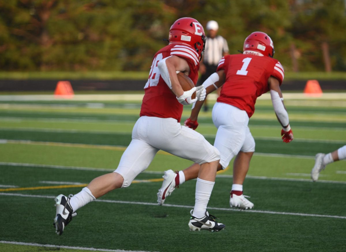 Junior Elliot Beister takes the ball toward the endzone. Red beat White 62-7 on Friday, August 18th.