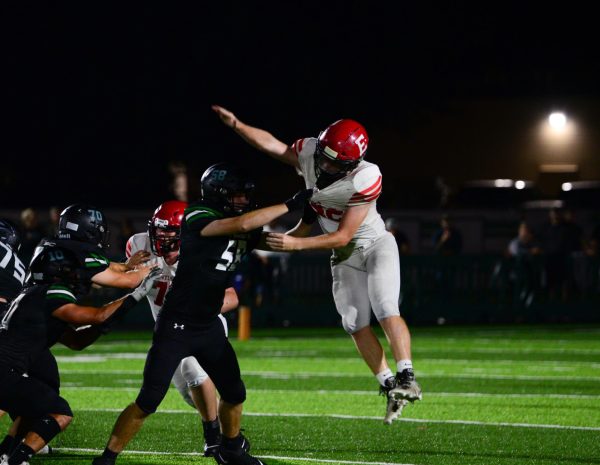 Junior Braden Kobiela jumps up to hit the football. The Antlers lost to the Skyhawks 45-0 on Friday, September 15th.