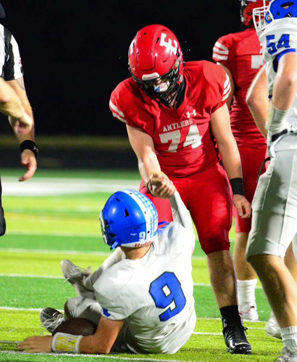 Junior Tim Boomgarden helps a Bennington player off the ground. The Antlers lost to the Badgers 28-7 on Friday, September 22nd.