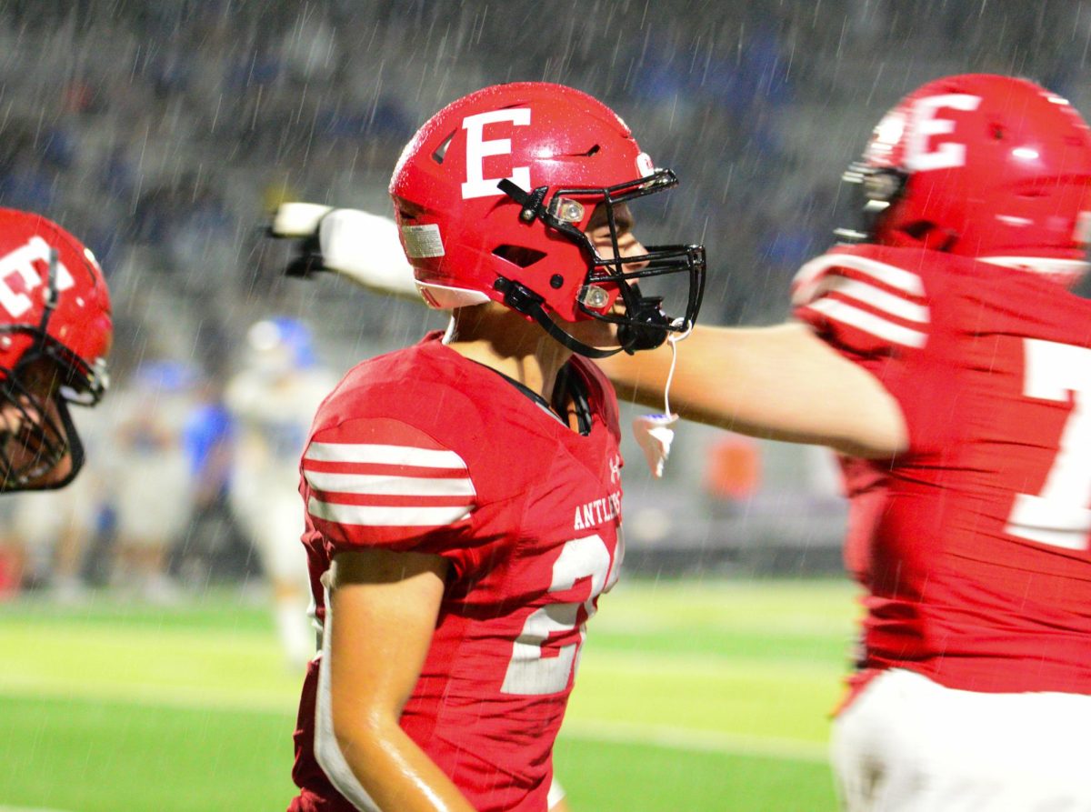 Junior Gus Schultz celebrates in the rain after a good play from Elkhorn. The Antlers lost to the Badgers 28-7 on Friday, September 22nd.