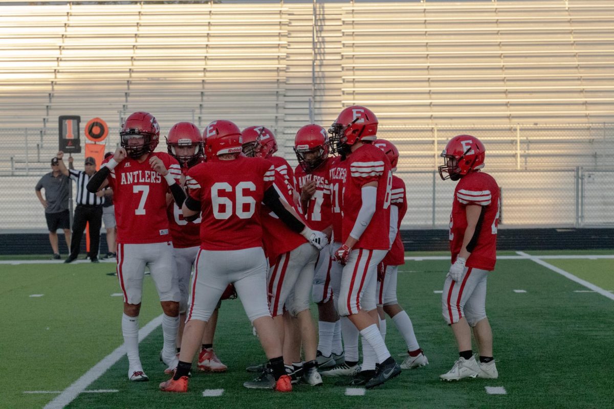 Freshman Antler offense meets before a play. Freshman Antlers lost 35-7 to Norris.            
