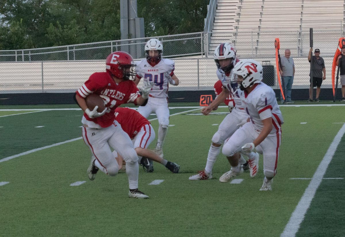 Freshman Carson Lane recovers the ball for the Antlers. Freshman Antlers lost 35-7 to Norris.            