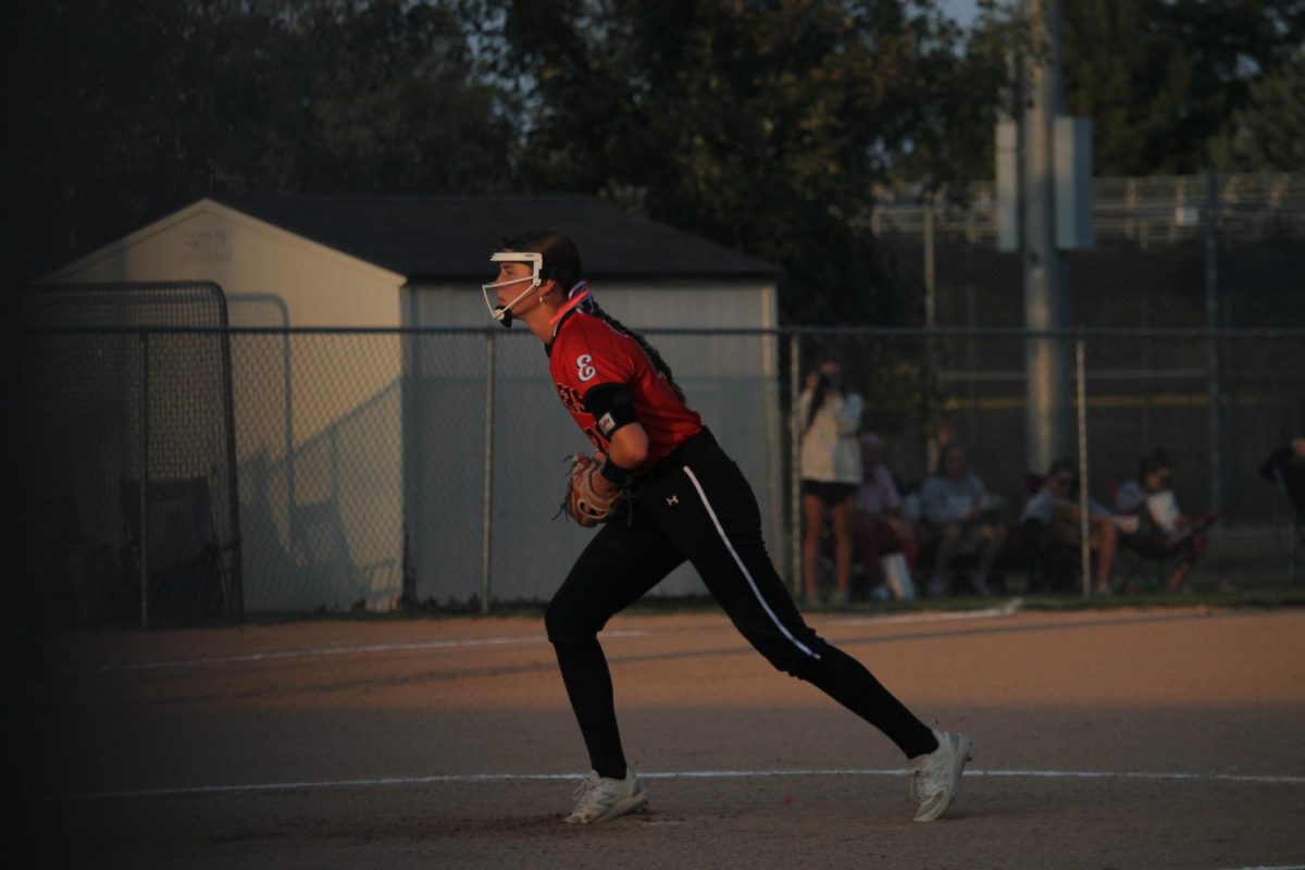 Senior, Claire Nuismer, sets her pitching position before the initial throw.