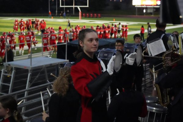 Senior Ashley Formo conducts the band during the homecoming football game, Friday, Sept. 22. 