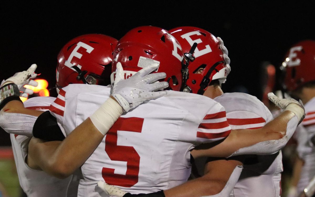 Senior Andrew Salvatore, senior Audric Bermel, and junior Peyton Turman congratulate each other after the game. The Antlers beat the Titans 26-24 on Friday, September 1st.