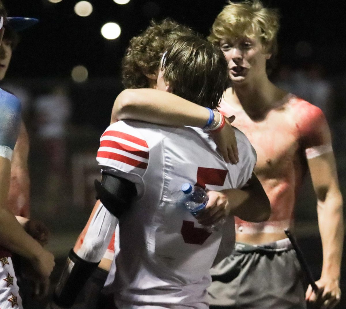 Senior Ryan Ellison gives senior Andrew Salvatore a hug after the game. The Antlers beat the Titans 26-24 on Friday, September 1st.