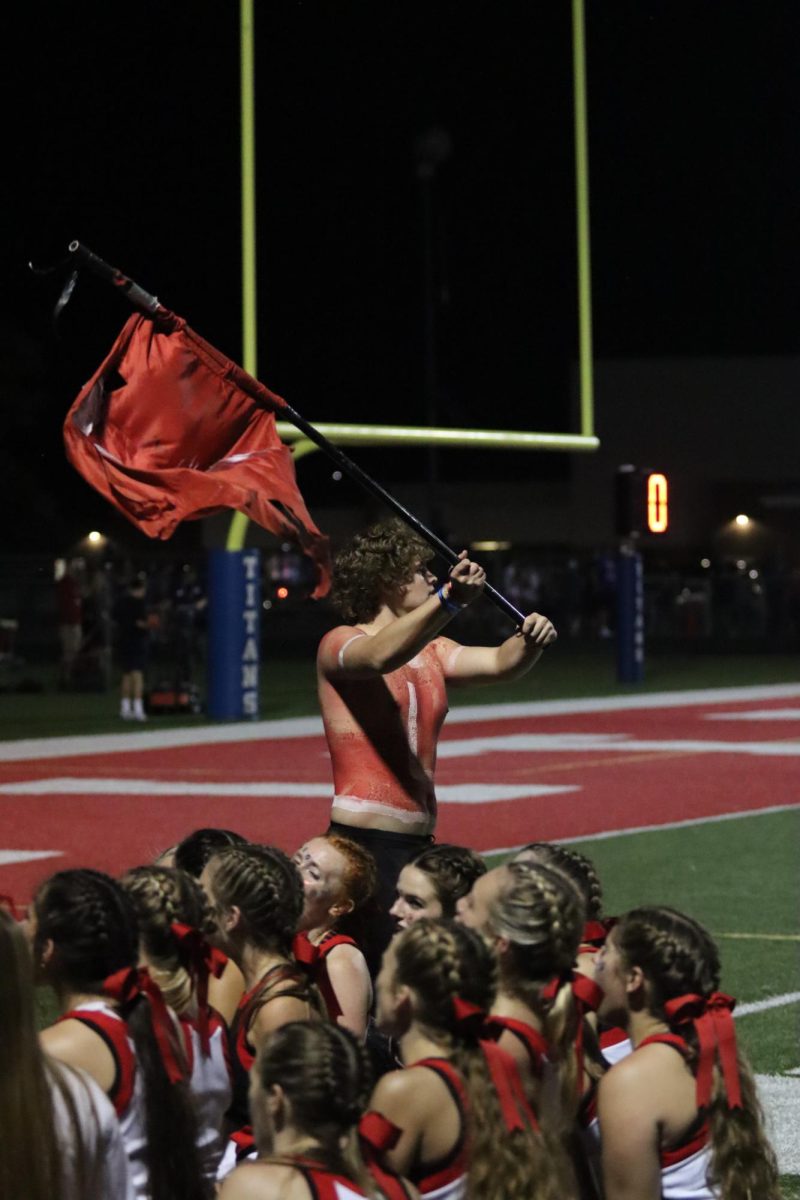 Senior Ryan Ellison flies the Elkhorn flag after the game. The Antlers beat the Titans 26-24 on Friday, September 1st.