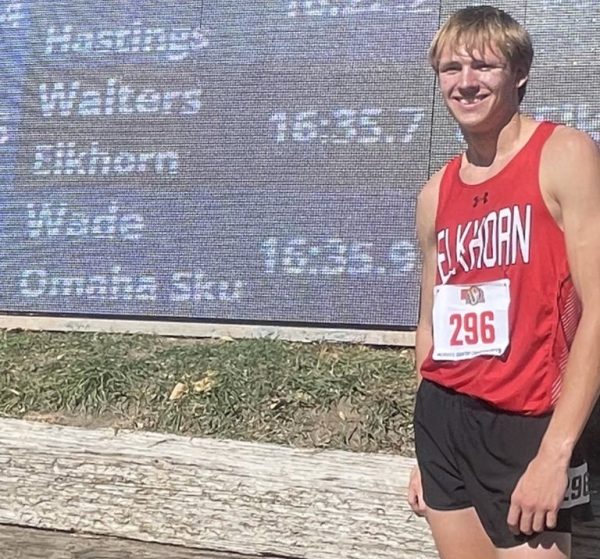 Senior Ethan Walters smiles after placing fifth at the NSAA state cross country meet in Kearney. Walters set a personal best on the course.