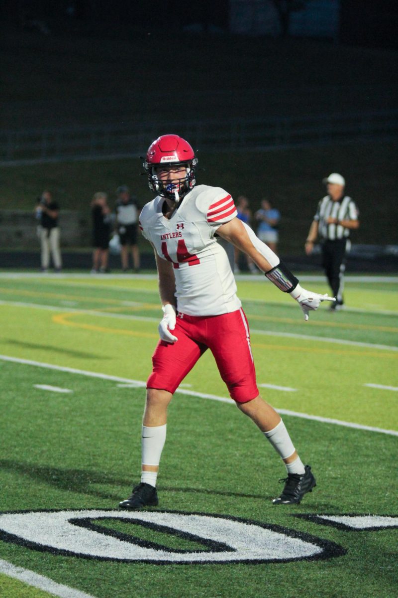Junior Peyton Turman signals towards the sidelines. Elkhorn lost to Elkhorn North 35-17 on Friday, September 29th.