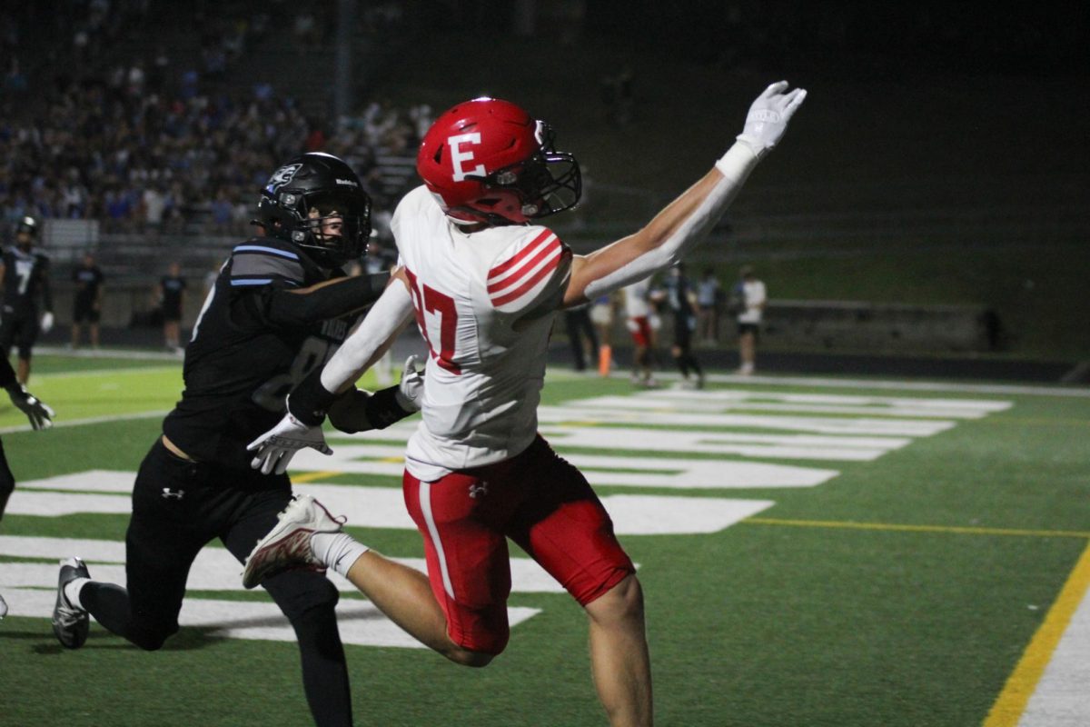 Junior Charlie Lamski attempts to catch the ball in the endzone. Elkhorn lost to Elkhorn North 35-17 on Friday, September 29th.
