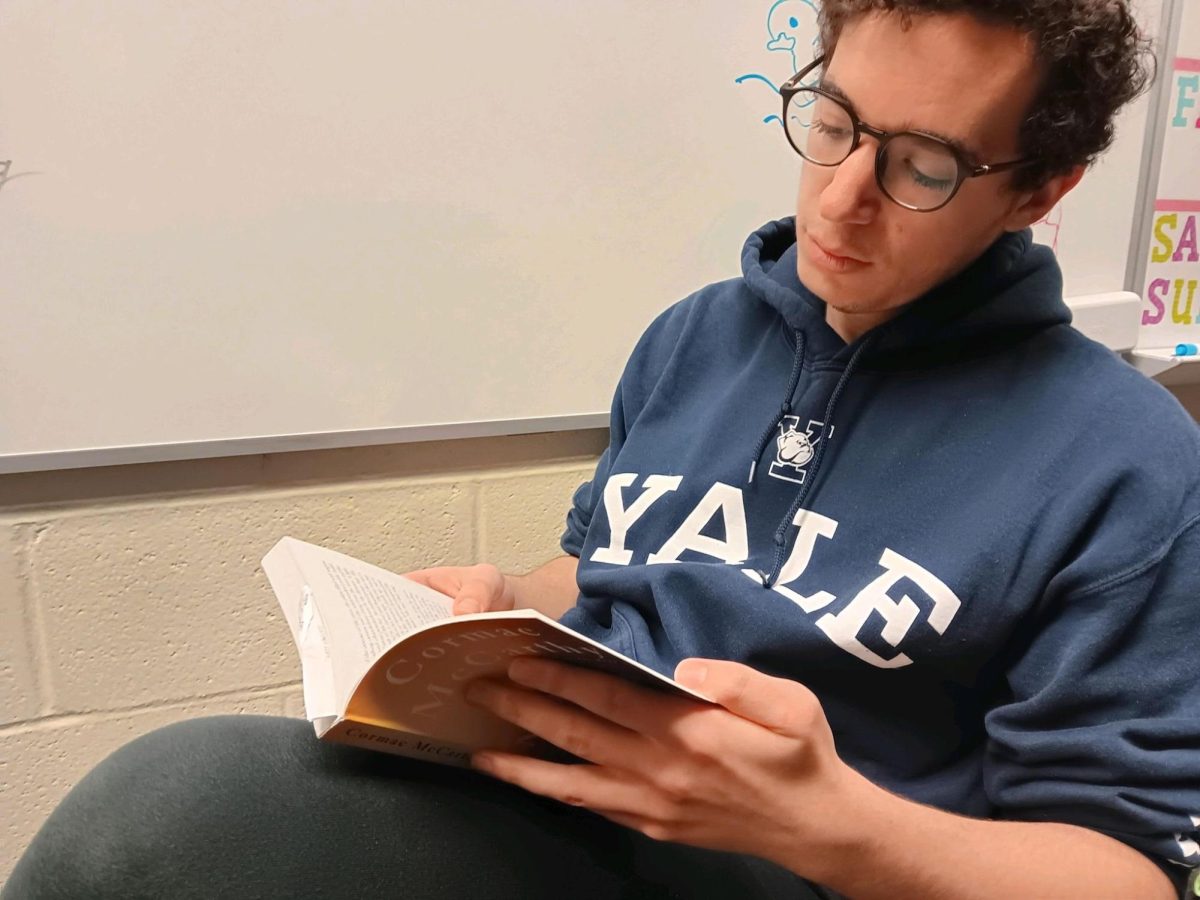Senior Ian Classen reads American literature. The reading challenge is intended to initiate more leisure reading among students and staff.