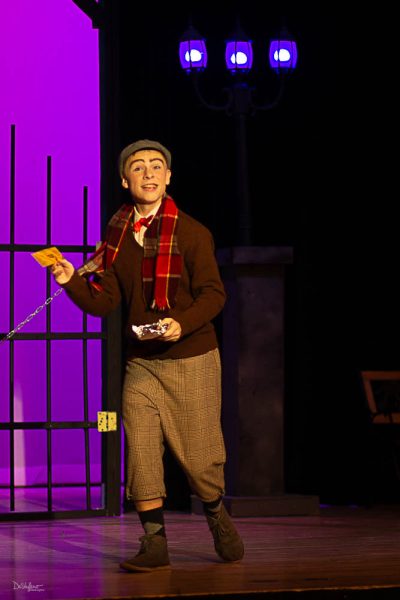 Charlie Bucket, played by sophomore Gage Petrick, is excited to find his Golden Ticket in a Wonka chocolate bar. The musical runs Nov. 3-5, 2023.