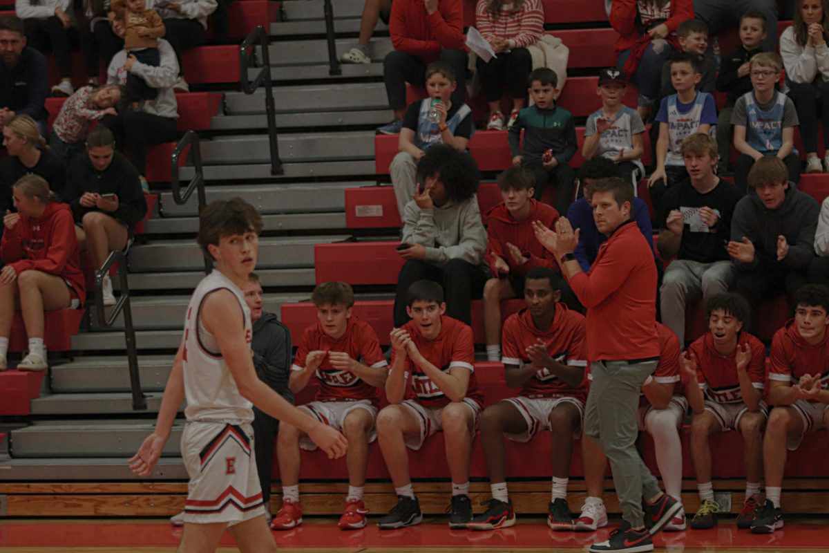 Sophomore Nixon Farmer gets an ovation by Coach Thompson and Teammates. Antler boys basketball team defeated Mt. Michael 67-56