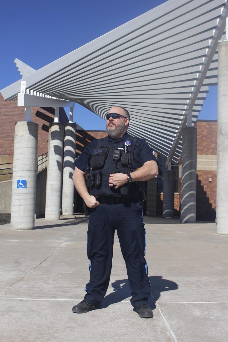 Kevin Potter stands in front of the school, protecting the wellbeing of staff and students. Officer Potter helps maintains security around the building. 