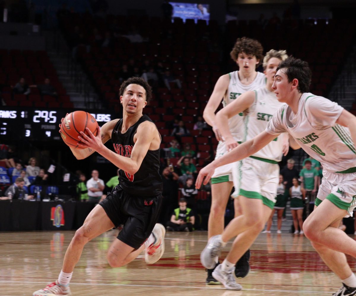 Senior Luke Howard picks up his dribble. Antlers lost to Skyhawks 61 to 69 in the State Quarter Finals.