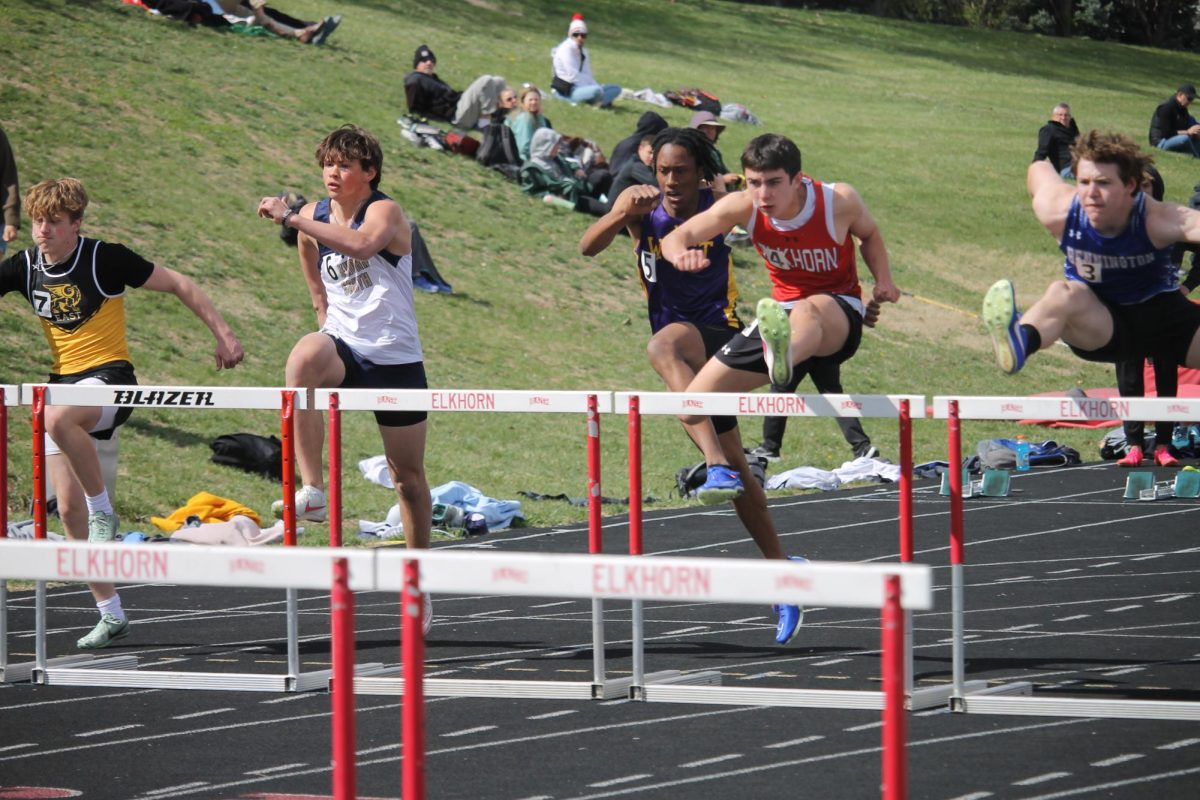 Freshman Brody Clevenger tries his best over the hurdles to make it to the finish line.
