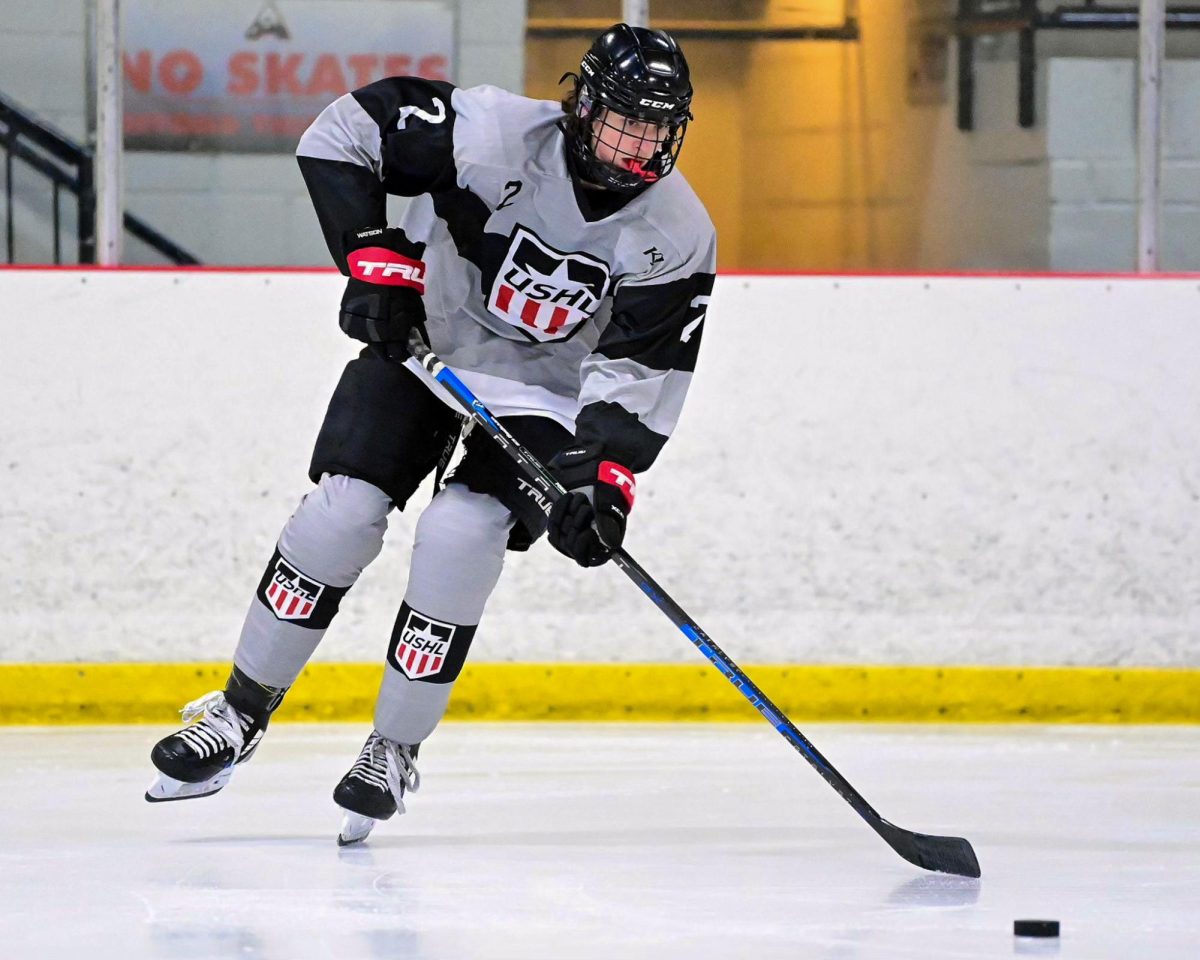 Junior Bradyn Holmes moves the puck up the ice during a recent game. 
Photo courtesy of Bradyn Holmes