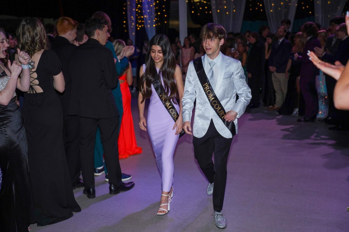 Seniors Sueda Akkaya and Mason Beister make their way up to the stage. 