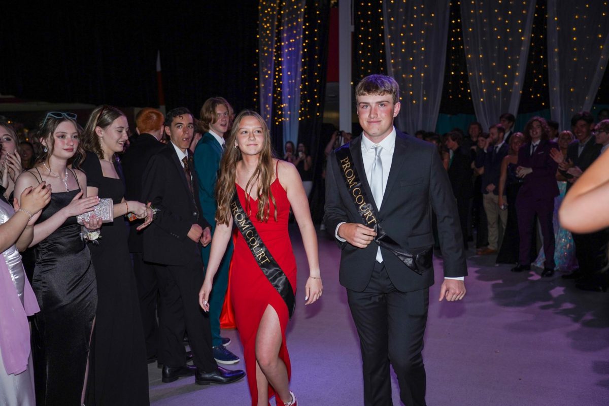 Ayshia Prince and Lance Williams walking through the crowd to get to coronation.