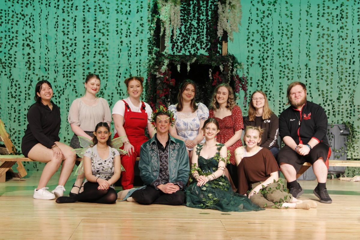 The senior cast and crew of A Midsummer Nights Dream pose for a photo before the final performance of the season.