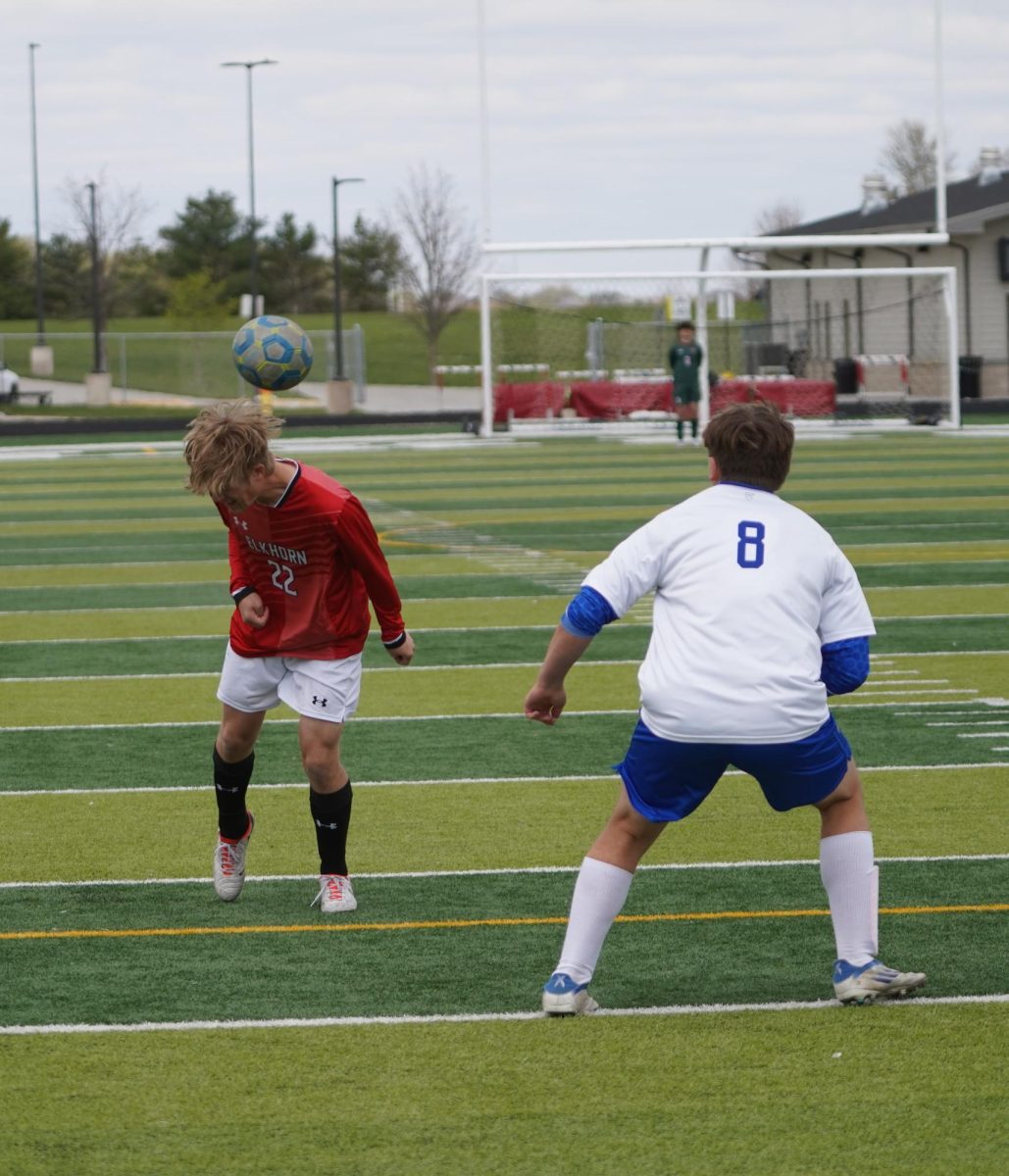 Senior Andrew Sutton heads the ball away from Grosss defender. The Antlers won 3 to 0. 