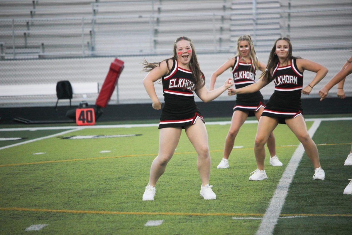 Senior Sophia Anderson dances at the red white scrimmage. The dance team made their half-time performance debut on August 22nd.  