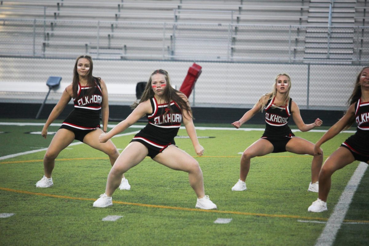 Senior Sophia Anderson dances at the red white scrimmage. The dance team made their half-time performance debut on August 22nd.  