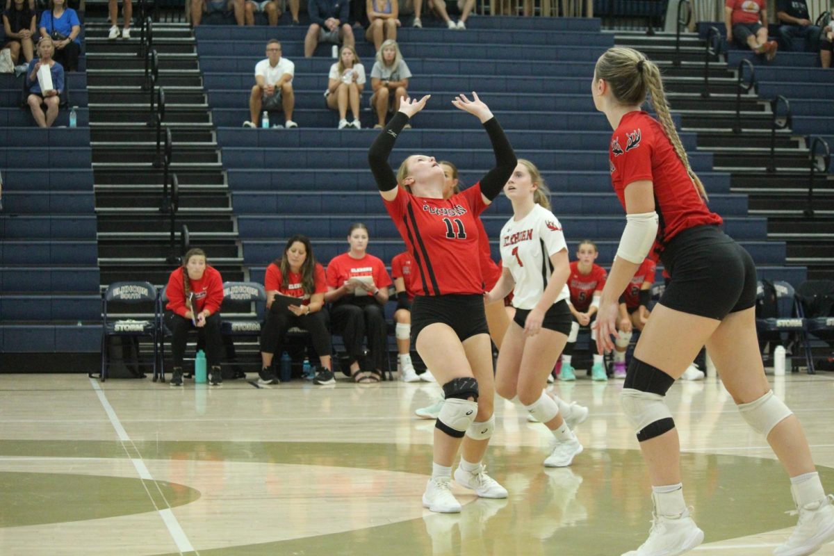 Senior Macie Burson sets the ball to her middle hitter, senior Addie Hunt. The Antlers lost to the Storm in the Volleyball Jamboree.