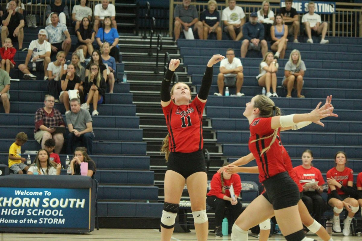 Senior Macie Burson sets the ball for Senior Addie Hunt. The Antlers lost to the Storm in the Volleyball Jamboree.