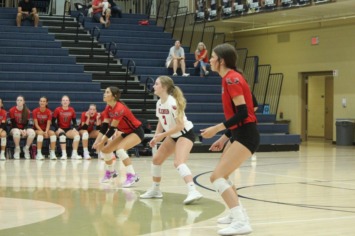 Senior Tatum Zegers and sophomores Bailey Ferguson and Kaiya Gilbert prepare for serve receive. The Antlers lost to the Storm in the Volleyball Jamboree.