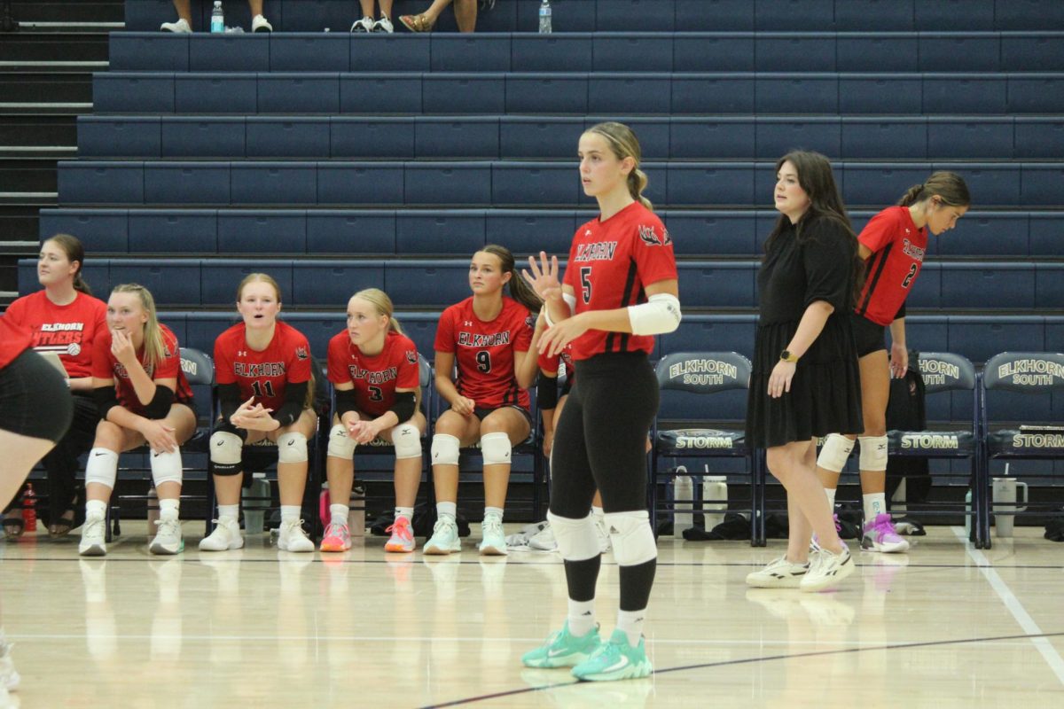 Senior Lauren Fats holds up the play number to her outside hitter. The Antlers lost to the Storm in the Volleyball Jamboree.