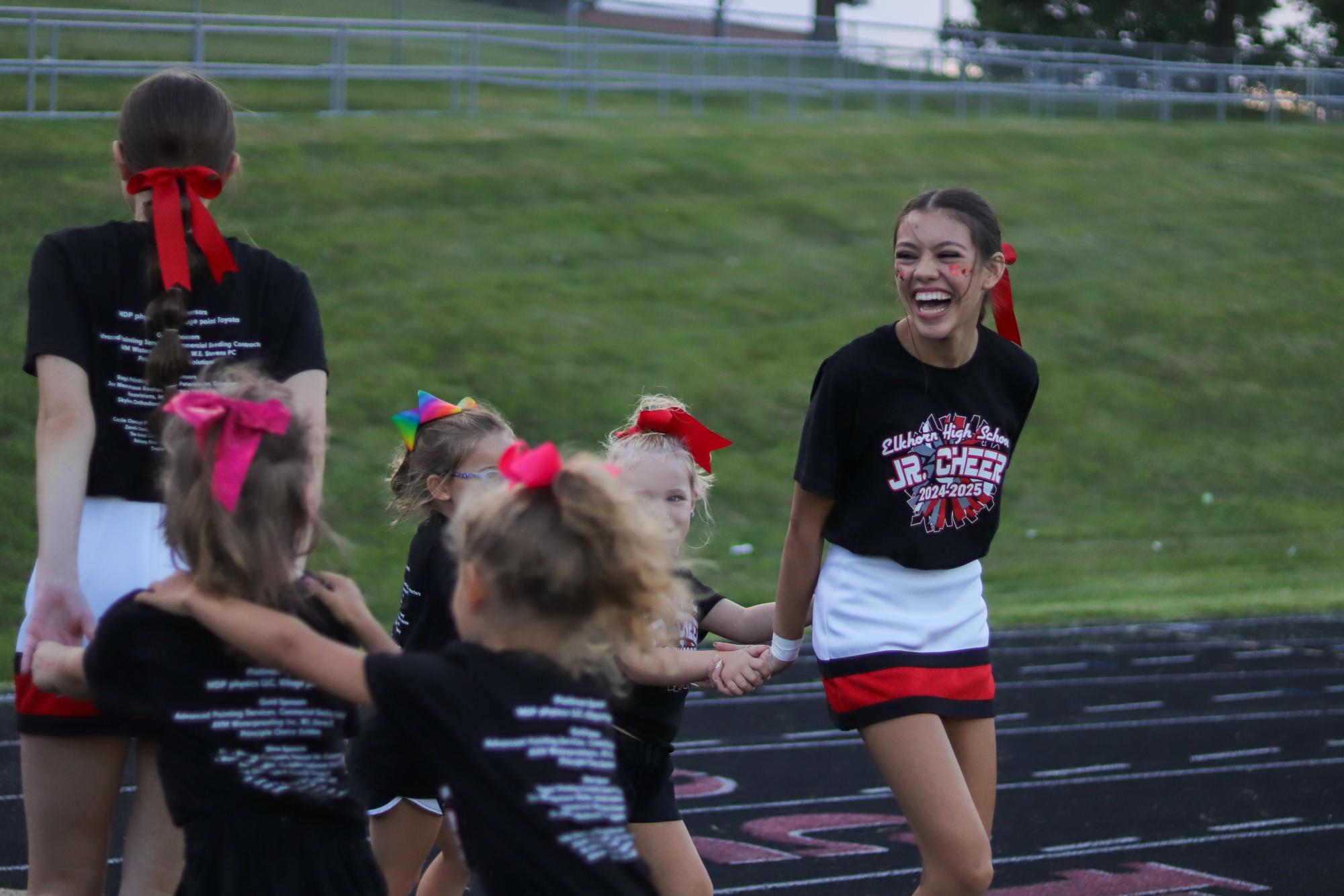 Junior,, Lauren Herbers, teaching her jr. cheerleaders the Antler way. This took place during the annual red/white scrimmage.