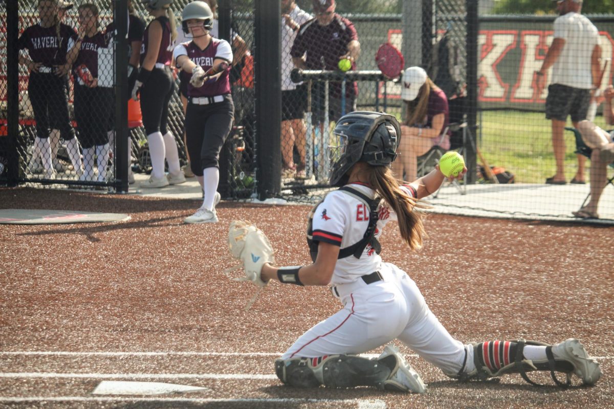 freshman catcher Kinsley Coleman throws the ball to second base. This picture took place in the JV game versus Waverly.