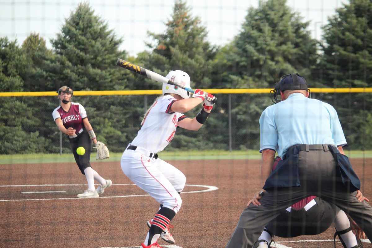 Junior Lorena Mishler strides out to swing at a ball. This picture took place at the JV game versus Waverly.