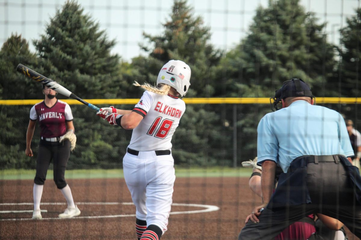 Junior Lorena Mishler finishes her swing. This picture took place at the JV game versus Waverly.