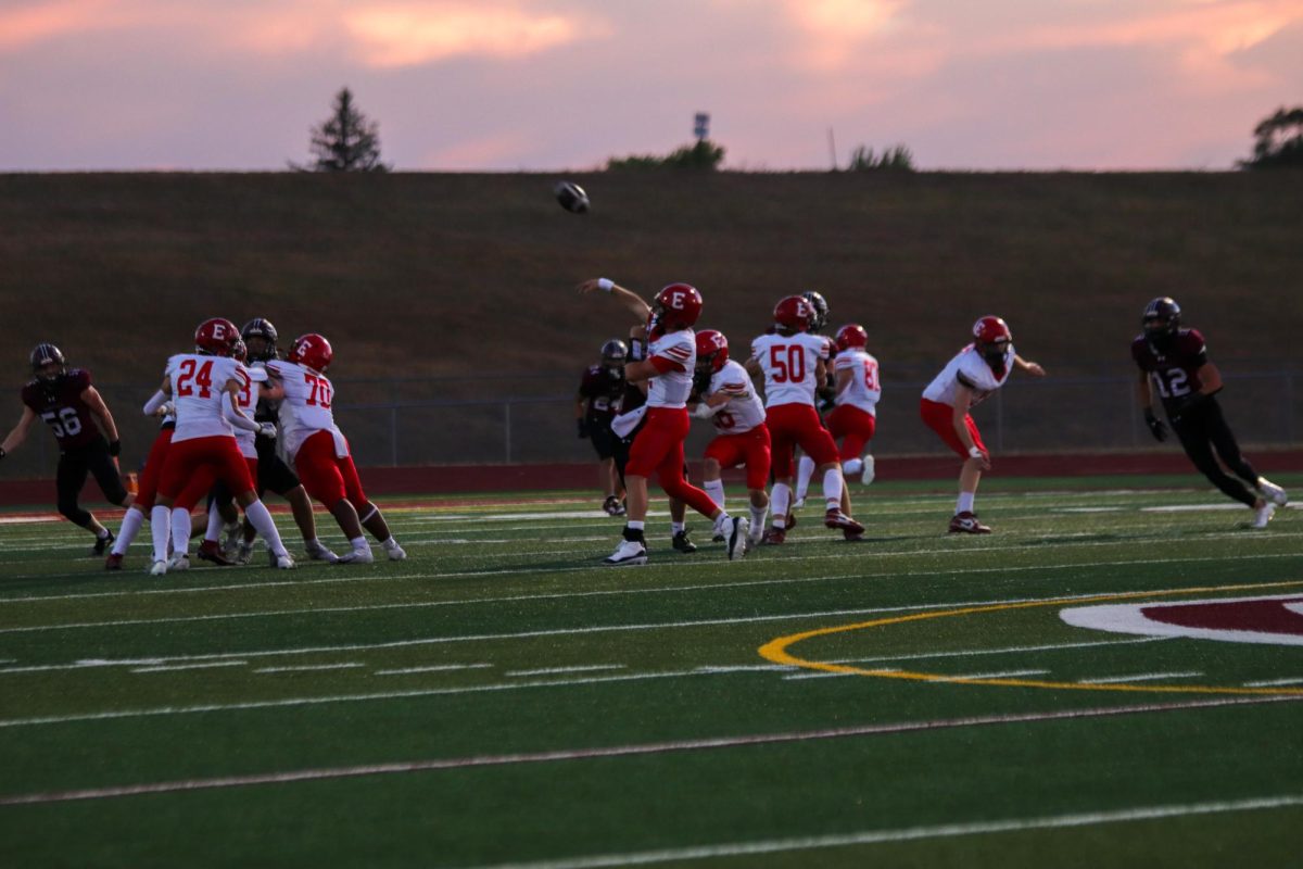 Senior Kayd Matthews is throwing a pass to his teammate. The final score for varsity football on 9/20 was 0-28 Waverly.